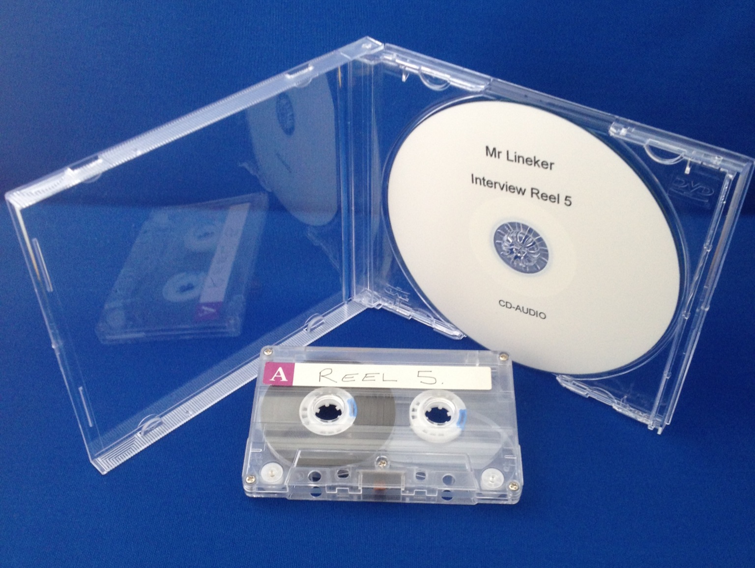 Shows an audio cassette tape and a CD Audio Disc