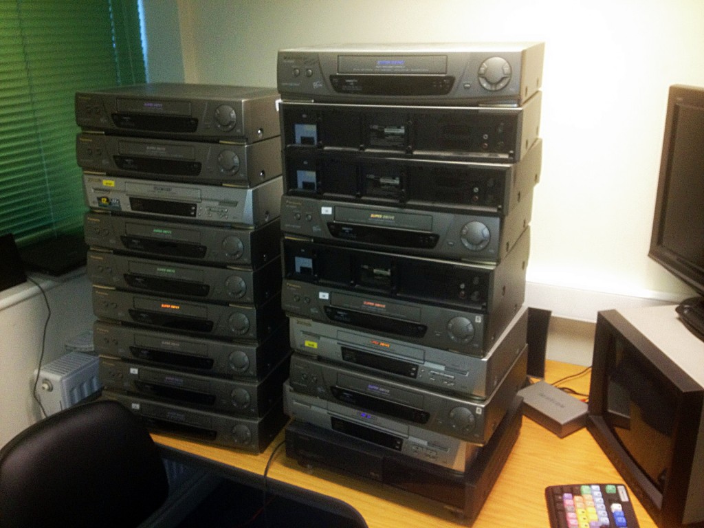 Stacks of VHS decks Stacks of VHS recorders on desk