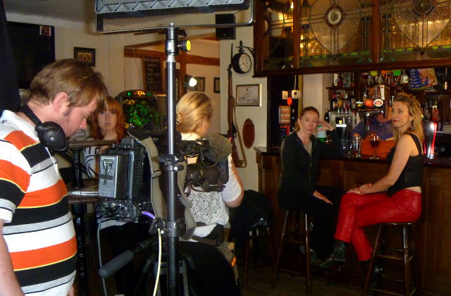 Film crew in a bar