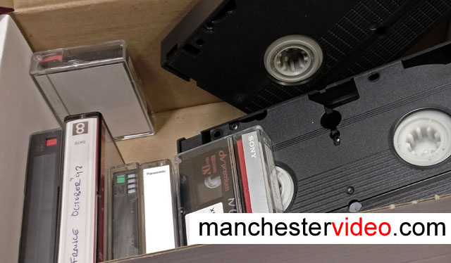 Box of old camcorder video tapes